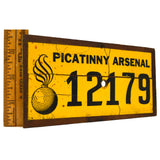 Vintage PICATINNY ARSENAL SIGN/NUMBER-PLATE Sticker on Wood CANNONBALL BOMB LOGO